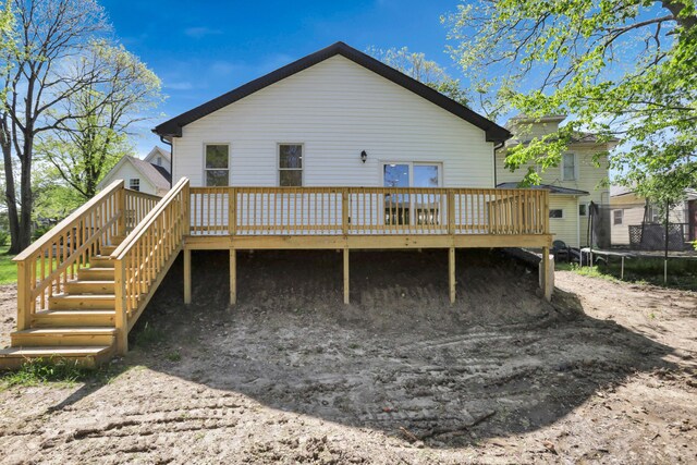 344 Buckingham St, Newark, OH 43055 - rear view of property featuring a trampoline, a wooden deck, and stairway