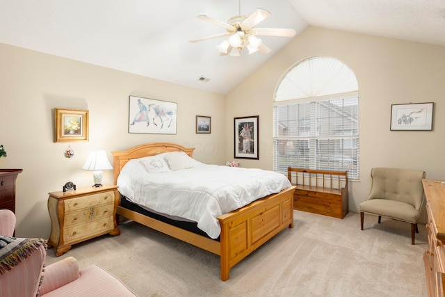 bedroom featuring lofted ceiling, ceiling fan, visible vents, and light colored carpet