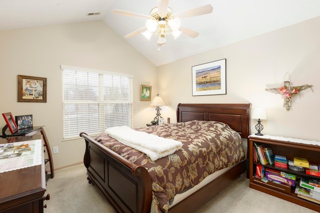 bedroom with vaulted ceiling, ceiling fan, visible vents, and light colored carpet