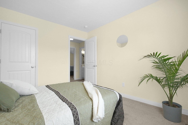 bedroom with carpet floors and baseboards