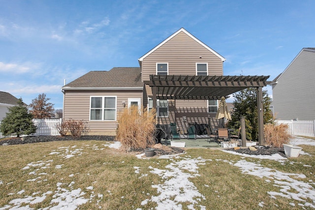 snow covered property with a patio area, fence, a lawn, and a pergola