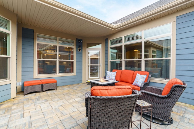 view of patio / terrace featuring an outdoor living space with a fire pit