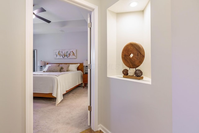 bedroom with baseboards, carpet, and a ceiling fan