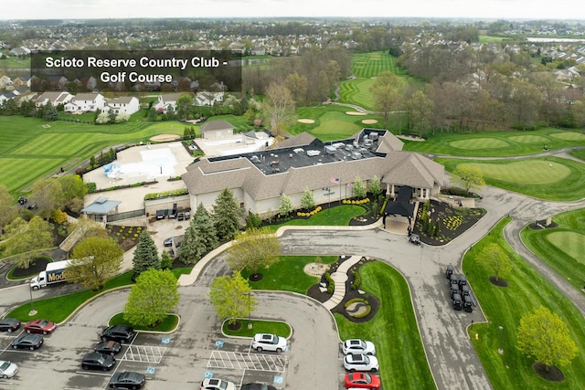 drone / aerial view with a residential view and golf course view