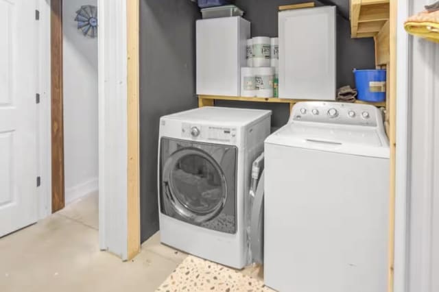 laundry area featuring laundry area and washer and clothes dryer