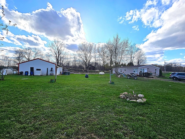 view of yard featuring an outbuilding and a pole building