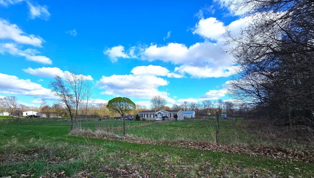 view of yard with a rural view