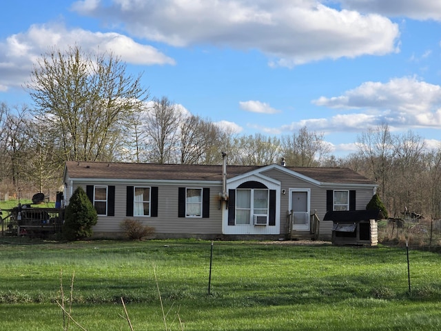view of front of house with a wooden deck and a front yard