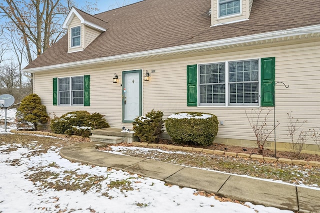 view of front of home featuring a shingled roof