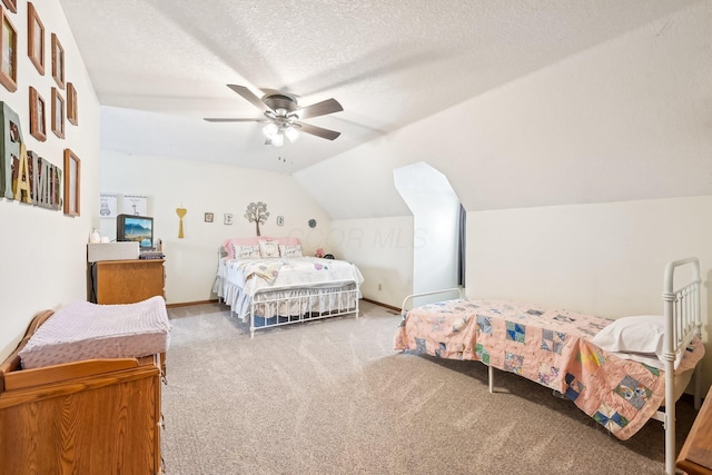 carpeted bedroom featuring lofted ceiling, baseboards, a ceiling fan, and a textured ceiling