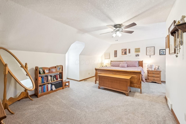 bedroom with baseboards, a ceiling fan, lofted ceiling, a textured ceiling, and carpet floors