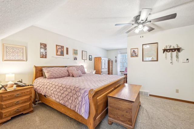 bedroom with light colored carpet, visible vents, a ceiling fan, a textured ceiling, and baseboards