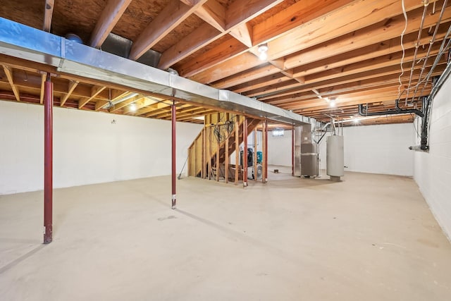 unfinished basement with heating unit and water heater