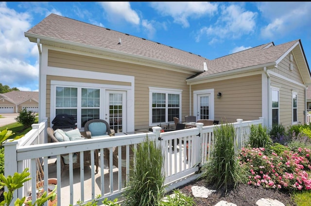 614 Newport Ln, Hebron, OH 43025 - rear view of house with a deck and a shingled roof