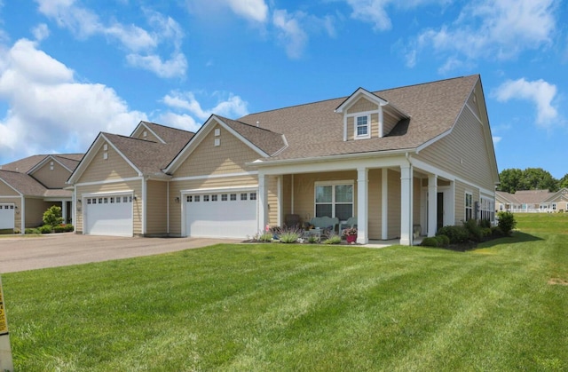 614 Newport Ln, Hebron, OH 43025 - view of front of house featuring a garage, concrete driveway, a front yard, a porch, and roof with shingles