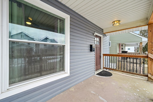 view of exterior entry with covered porch