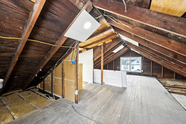 attic featuring an upstairs landing