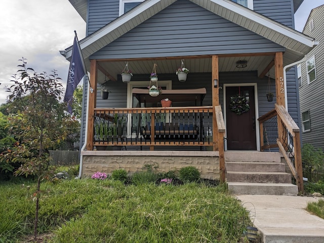 doorway to property with covered porch