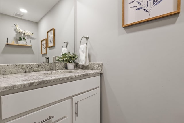 bathroom with recessed lighting, visible vents, and vanity