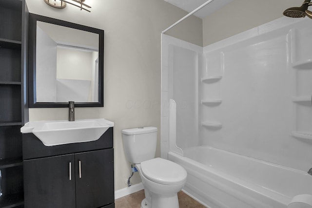 full bath featuring toilet, washtub / shower combination, tile patterned flooring, baseboards, and vanity