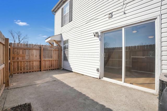 view of patio / terrace featuring fence and central AC