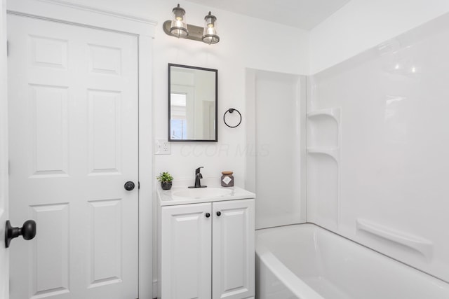 bathroom with bathtub / shower combination and vanity