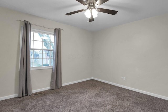 unfurnished room featuring ceiling fan, carpet flooring, visible vents, and baseboards