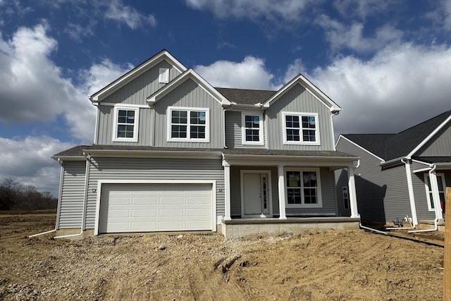 view of front facade featuring driveway, a porch, board and batten siding, roof with shingles, and an attached garage