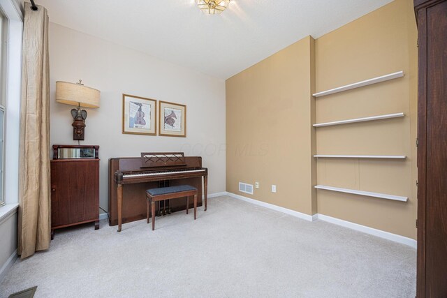 413 Ashmoore Cir E, Powell, OH 43065 - living area featuring baseboards, visible vents, and carpet flooring