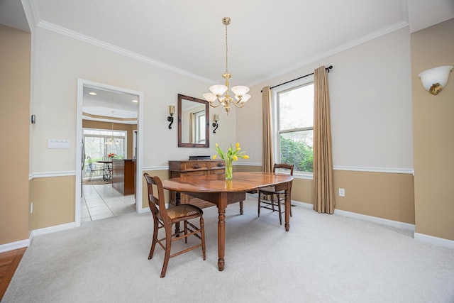 413 Ashmoore Cir E, Powell, OH 43065 - dining space featuring a chandelier, crown molding, and light carpet