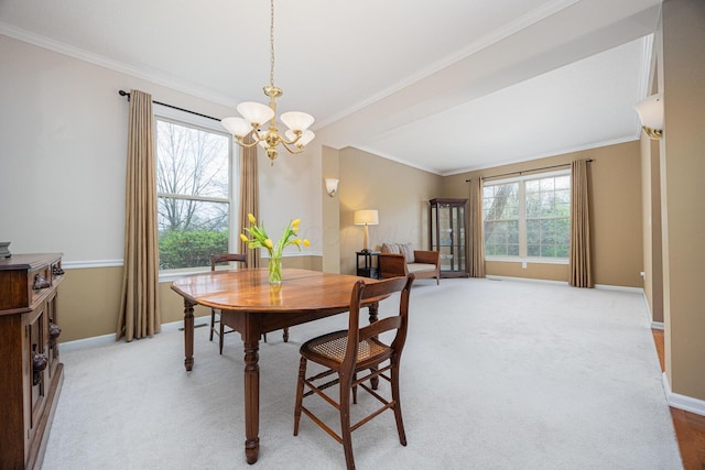 413 Ashmoore Cir E, Powell, OH 43065 - dining area featuring baseboards, light colored carpet, an inviting chandelier, and crown molding