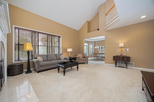 413 Ashmoore Cir E, Powell, OH 43065 - living room with baseboards, high vaulted ceiling, and carpet floors