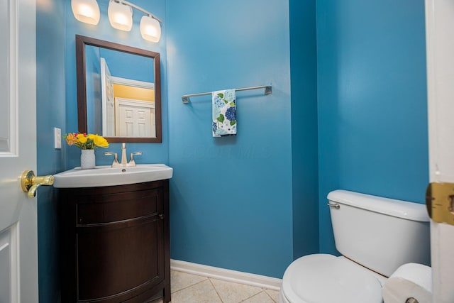 413 Ashmoore Cir E, Powell, OH 43065 - half bath featuring baseboards, toilet, tile patterned flooring, and vanity