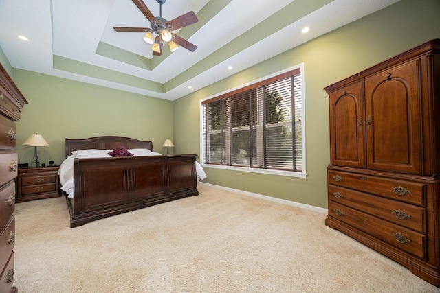 413 Ashmoore Cir E, Powell, OH 43065 - bedroom featuring a ceiling fan, a raised ceiling, light colored carpet, and baseboards