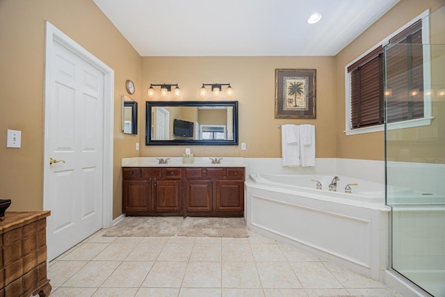413 Ashmoore Cir E, Powell, OH 43065 - bathroom with tile patterned flooring, a shower stall, double vanity, a sink, and a garden tub