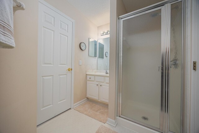 413 Ashmoore Cir E, Powell, OH 43065 - bathroom with vanity, a stall shower, and baseboards