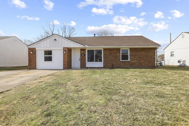 ranch-style house with roof with shingles, a front yard, board and batten siding, and brick siding