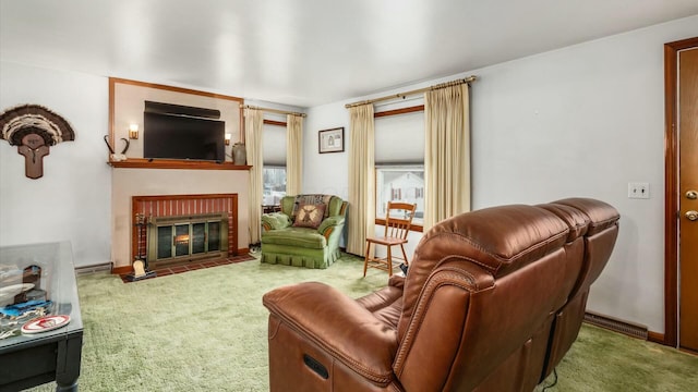 living area with carpet, visible vents, a fireplace, and baseboards