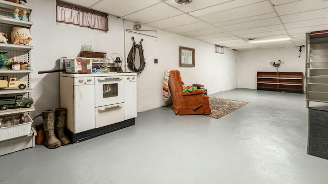 finished below grade area featuring a paneled ceiling and visible vents