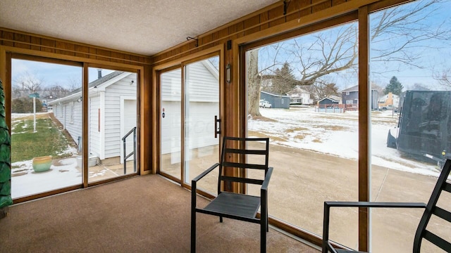 unfurnished sunroom with a residential view