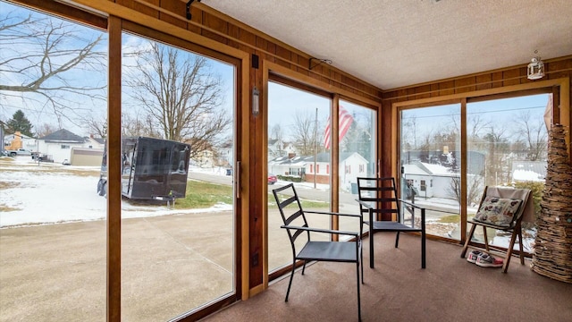 unfurnished sunroom featuring a residential view