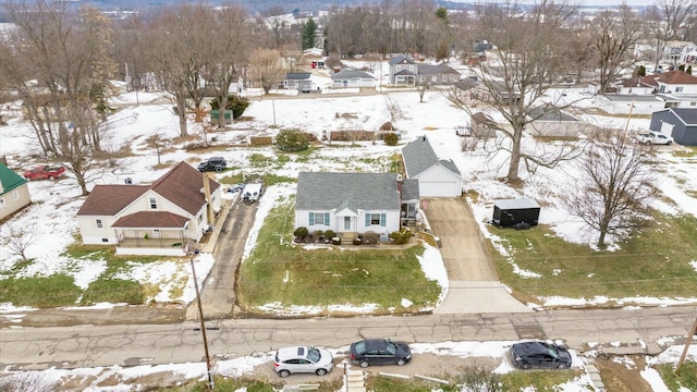 snowy aerial view featuring a residential view