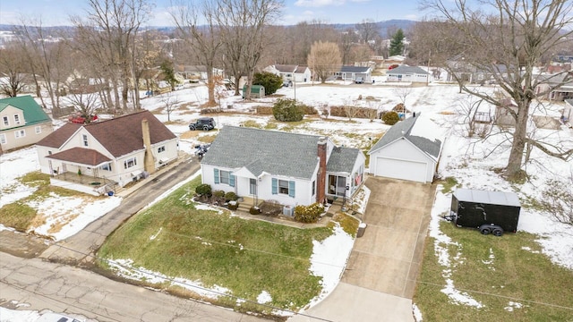 snowy aerial view featuring a residential view