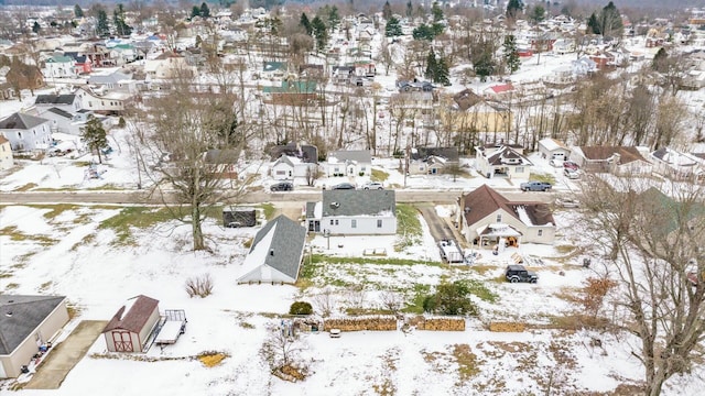 snowy aerial view featuring a residential view