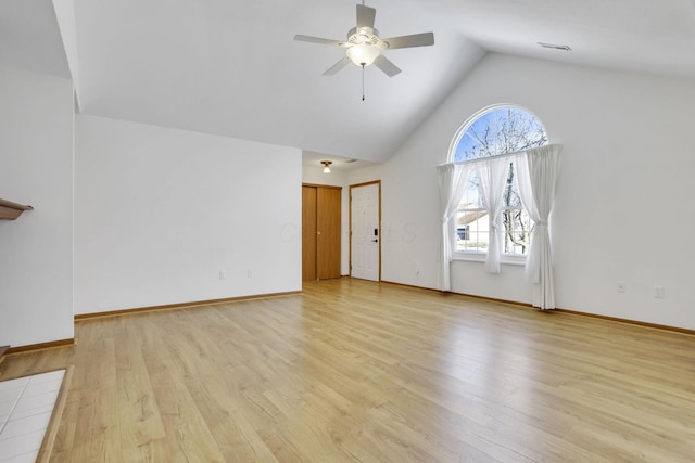 unfurnished living room featuring ceiling fan, high vaulted ceiling, visible vents, baseboards, and light wood-style floors