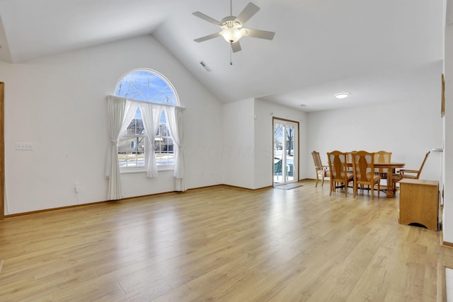 living room featuring plenty of natural light, light wood-style flooring, visible vents, and ceiling fan