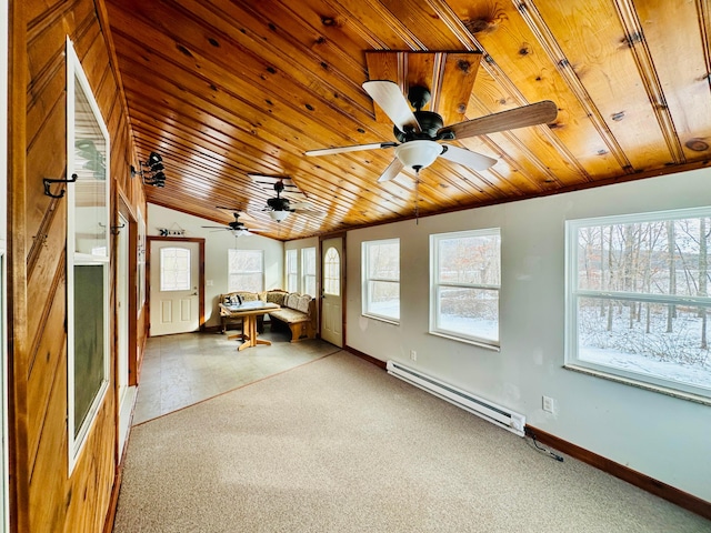 unfurnished sunroom with wooden ceiling, a baseboard radiator, and a wealth of natural light