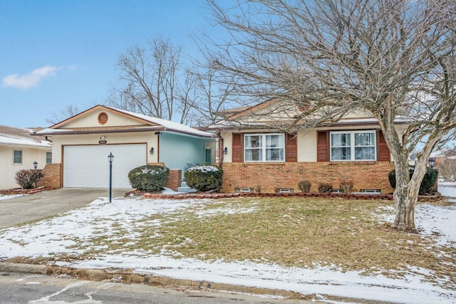 view of front of home with a garage, concrete driveway, and brick siding