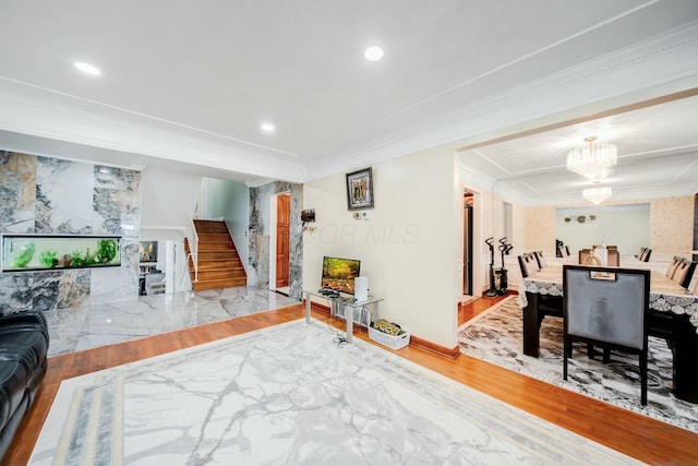 interior space with a chandelier, light wood-style flooring, recessed lighting, stairway, and crown molding