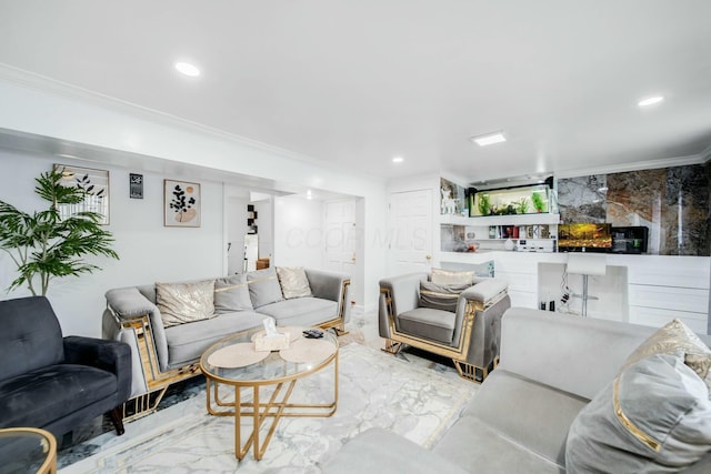 living area with ornamental molding, recessed lighting, and marble finish floor